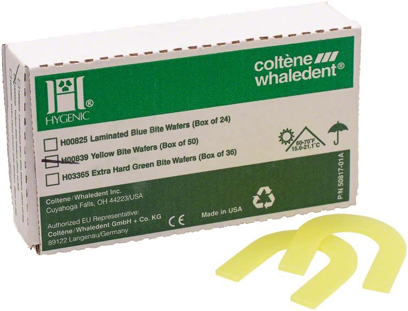 Gelbe HYGIENIC Biss-Schablonen vor Produktverpackung, U-förmig und weich.