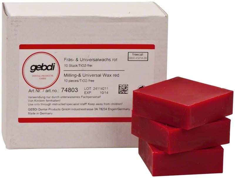 Rote Fräswachsblöcke vor einer Verpackung mit Produktinformationen.