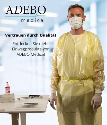 Schutzkittel 125 x 140 cm in Gelb, getragen von einem maskierten Modell in klinischer Umgebung.