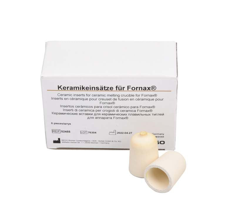 Keramikeinsätze für Fornax®-Keramik-Schmelztiegel neben Produktverpackung.
