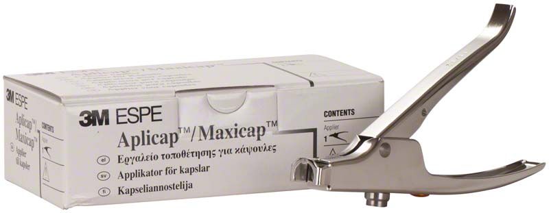 3M™ Aplicap™ Applier aus Metall neben Produktverpackung auf weißem Hintergrund.