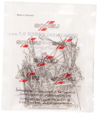 Dreiecksklammern Menzanium in transparenter Verpackung mit rotem Aufdruck.