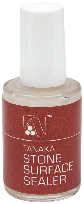 Steinoberflächenversiegelerflasche mit rotem Etikett und weißem Verschluss.