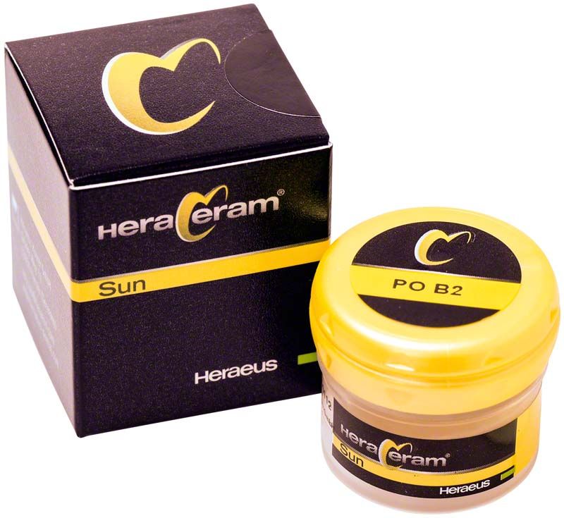 HeraCeram® Sun Pastenopaker PO B2 in gelbem Behälter neben schwarzer Verpackung.