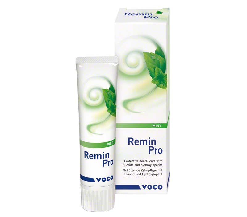 Zahnpasta Remin Pro® Minze mit Verpackung und grünem Blattmotiv.