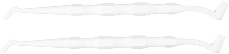 Zahnmedizinischer Halter aus weißem Polypropylen mit integriertem Spatel.