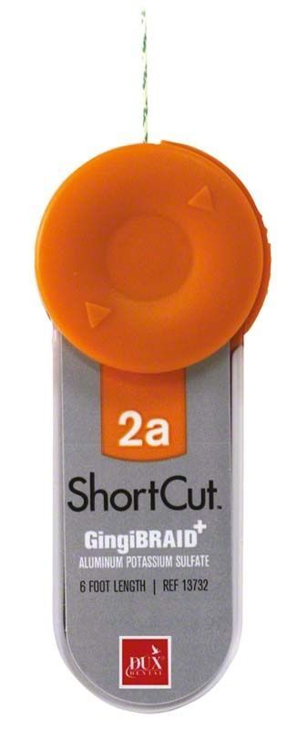 Orange und silberne Verpackung des ShortCut™ Retraktionsfadensystems.