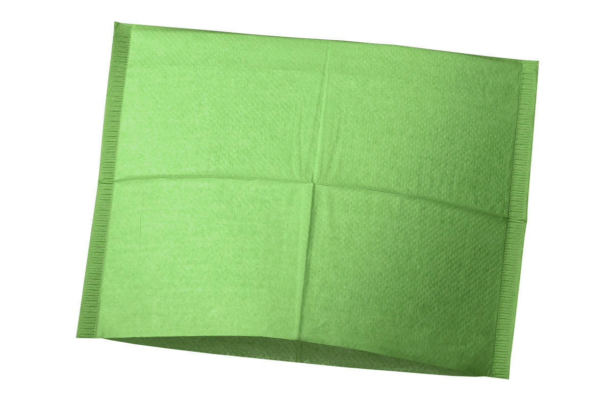 Grüner Kopfstützenüberzug für Zahnarztstühle zur Schutz vor Verschmutzungen.