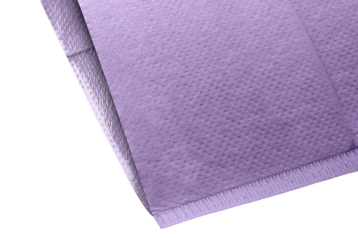 Lila Kopfstützenüberzug mit texturierter Oberfläche für Zahnarztstühle.