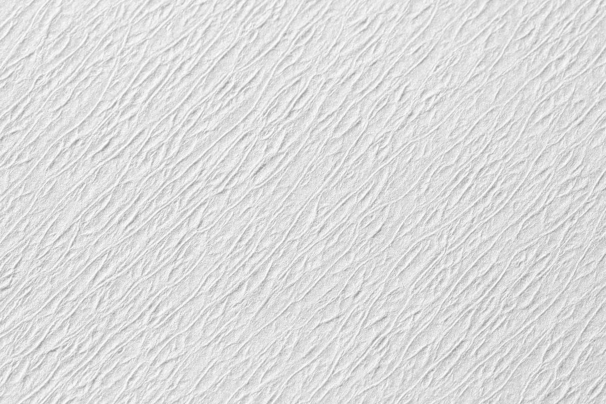 Gelbes Norm Traypapier aus Zellstoff, Nahaufnahme der strukturierten Oberfläche.