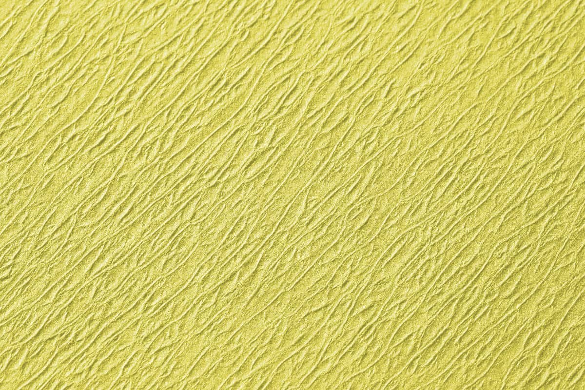 Gelbes Norm Traypapier aus Zellstoff mit strukturierter Oberfläche.