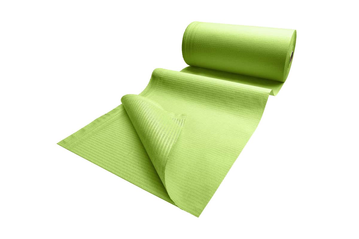 Patientenumhang aus Polyethylen in Grün, teilweise entrollt.