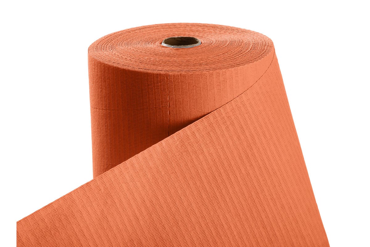 Patientenumhang aus Polyethylen in Grün, aufgerollt.