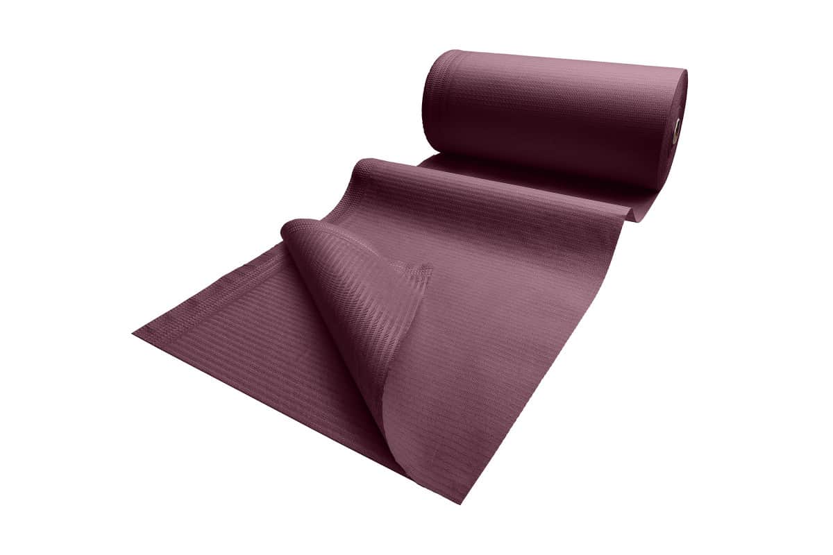 Patientenumhang aus Polyethylen in dunklem Lila, teilweise ausgerollt.