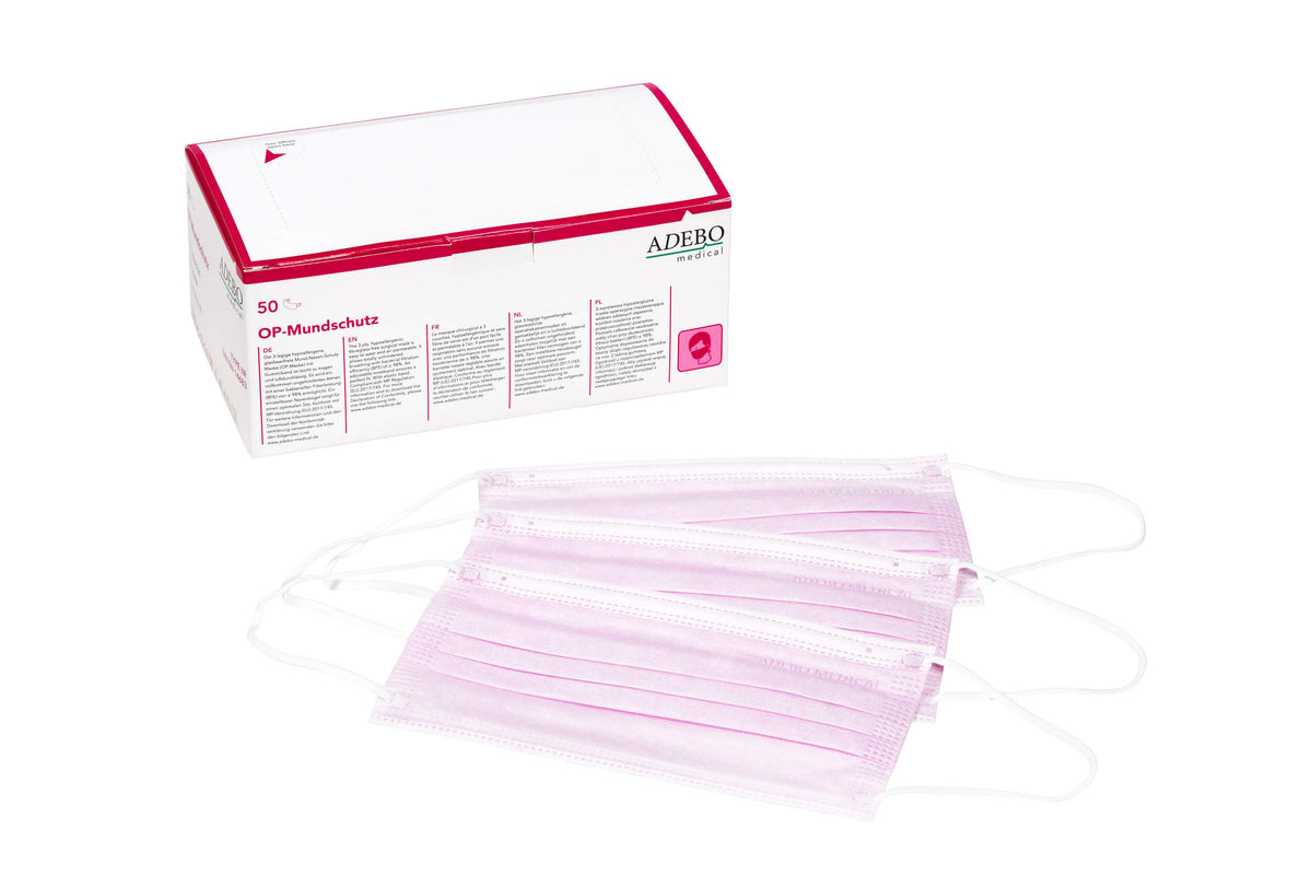 Rosa 3-lagiger Mundschutz mit elastischen Bändern vor Verpackung.