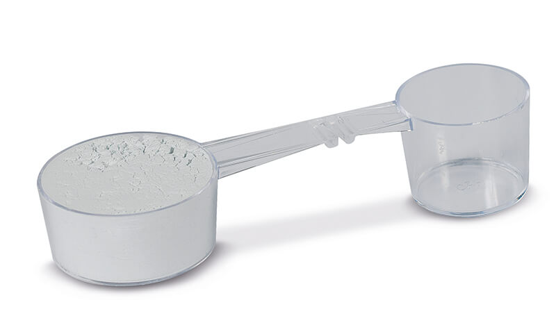 Messlöffel mit Alginatpulver und Farbindikator von Müller-Omicron.
