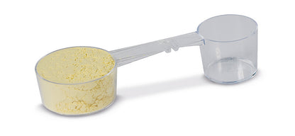 Messlöffel mit gelbem Alginatpulver und Farbindikator von Müller-Omicron.